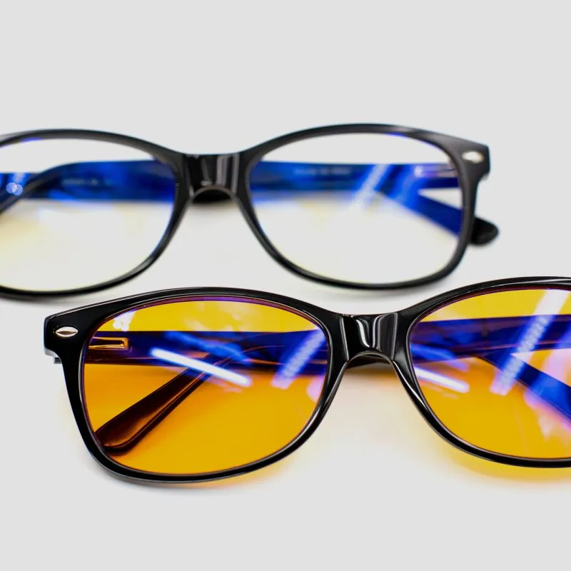 Picture of yellow blue light blocking glasses on white background - 2 for 1